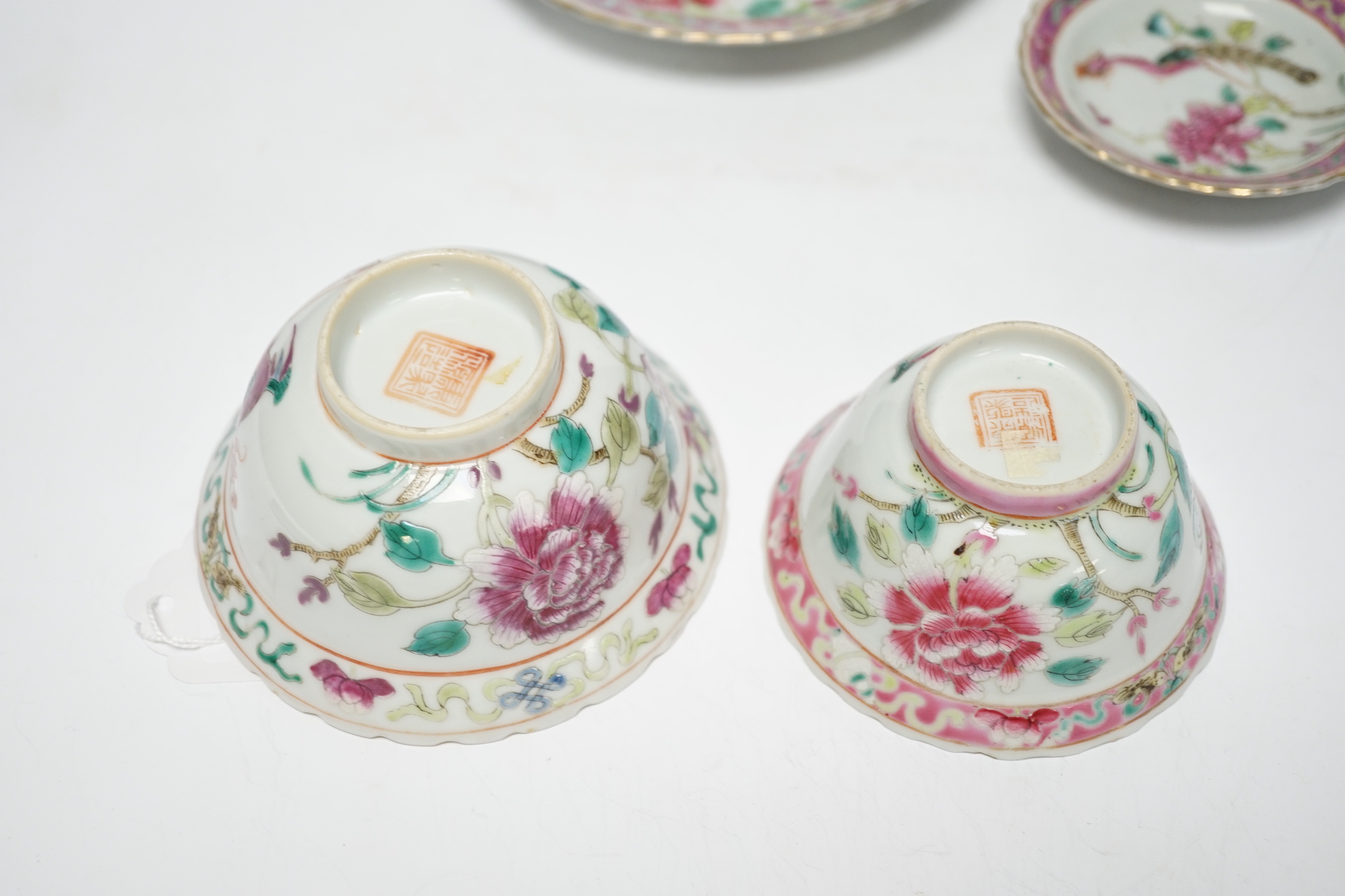 Two Chinese Straits Nonya ware famille rose tea bowls, larger 11cm diameter, and two saucer dishes, Guangxu period